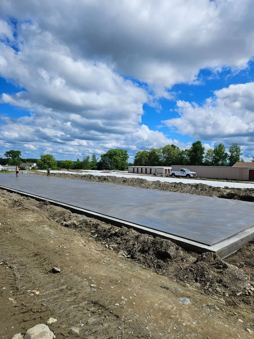 Finished slab beside self-storage buildings